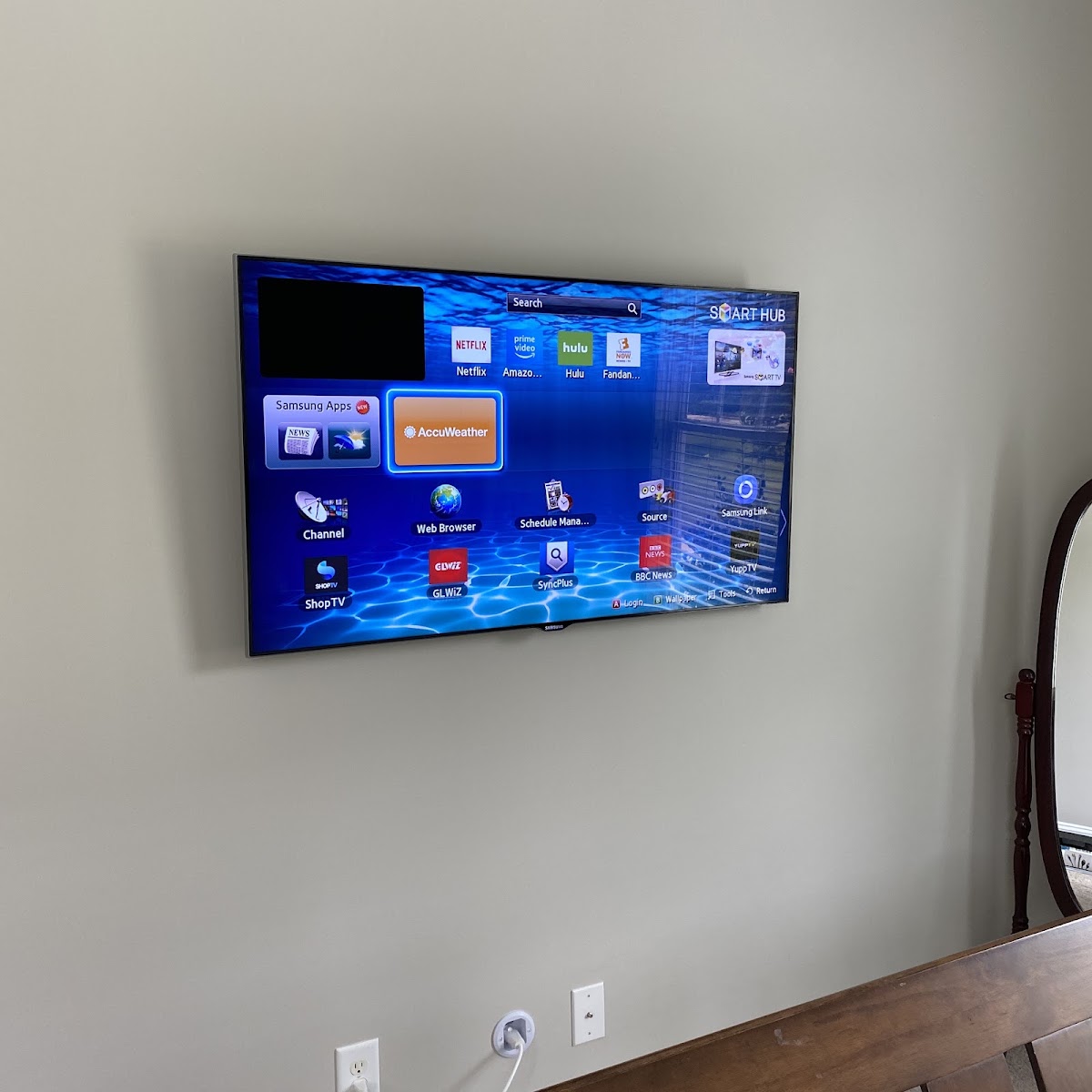 Flat screen TV mounted on a living room wall